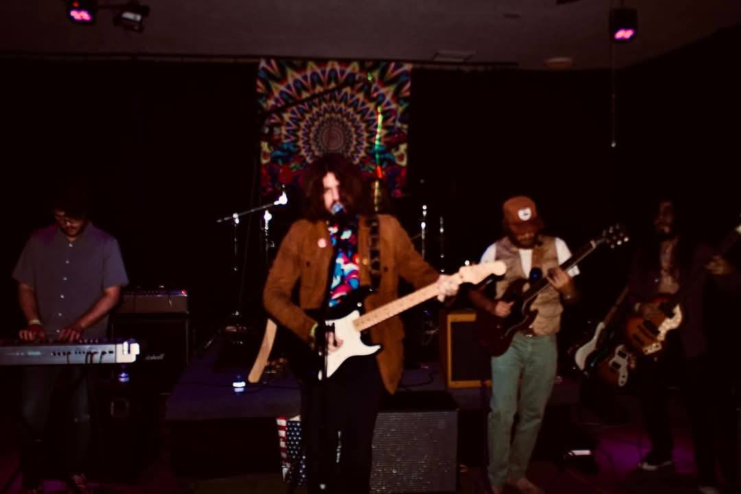 Humble Fish performing live with psychedelic backdrop